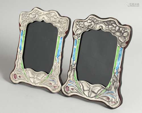 A PAIR OF ART NOUVEAU STYLE SILVER AND ENAMEL PHOTOGRAPH FRA...