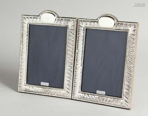 A PAIR OF SILVER PHOTOGRAPH FRAME 7.5 x 5.5ins