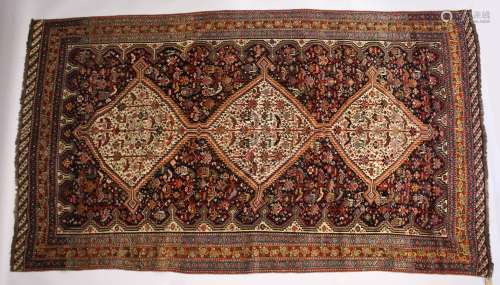 A GOOD LARGE EARLY 20TH CENTURY QASHQAI CARPET with three ce...