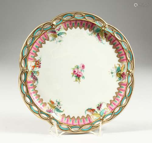 AN ENGLISH PORCELAIN PLATE with pierced border and painted w...