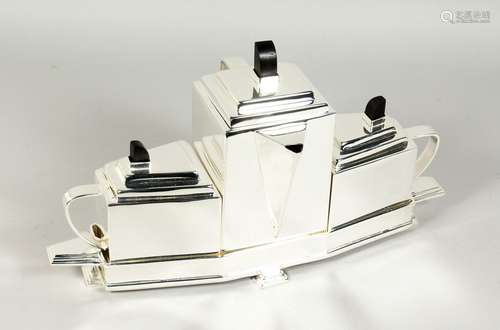 A CHRISTOPHER DRESSER DESIGN THREE PIECE PLATED TEA SET on a...