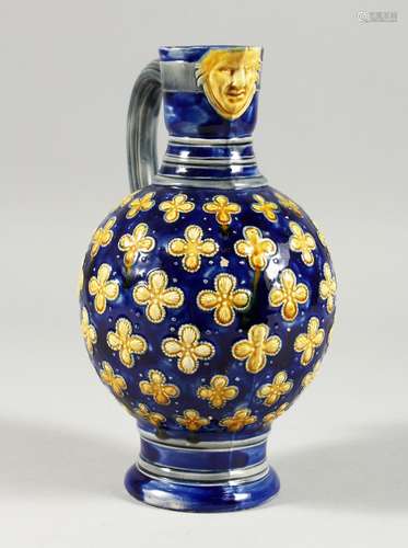 A MINTON MAJOLICA BLUE GROUND VASE with mask spout. 8ins hig...