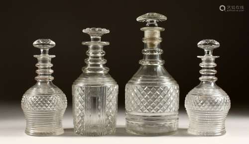 A PAIR OF CIRCULAR HOBNAIL CUT DECANTER AND STOPPERS. 7ins h...