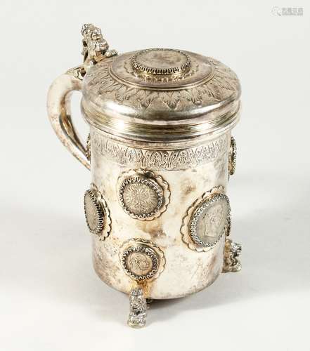 A CONTINENTAL .835 SILVER TANKARD AND COVER inset with silve...