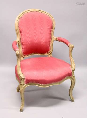 A GEORGE III ARM CHAIR, with padded back, arms and seat on c...