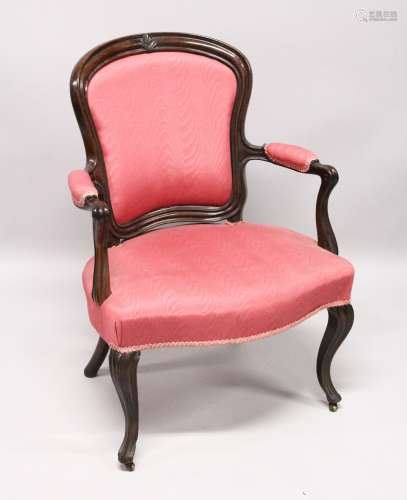 A GEORGE III SHAPED BACK ARM CHAIR with padded back, arms an...