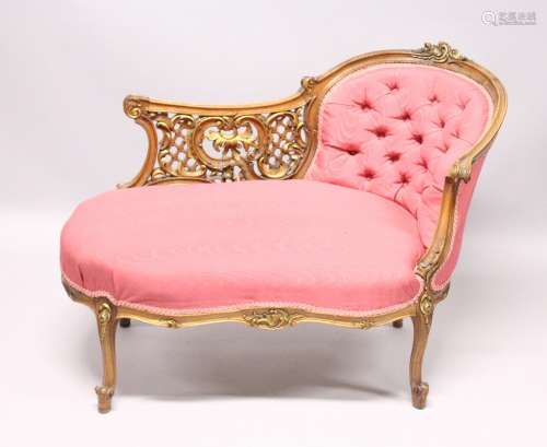 A VICTORIAN MAHOGANY PIERCED AND GILDED CHAISE LOUNGE, with ...
