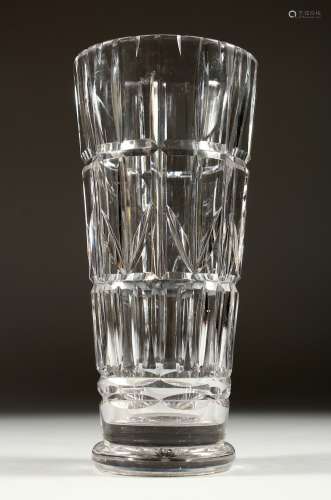 A LARGE WALSH SIGNED CUT GLASS VASE 10ins high.