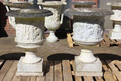 A SUPERB NEAR PAIR OF ITALIAN CARVED WHITE MARBLE URNS ON ST...