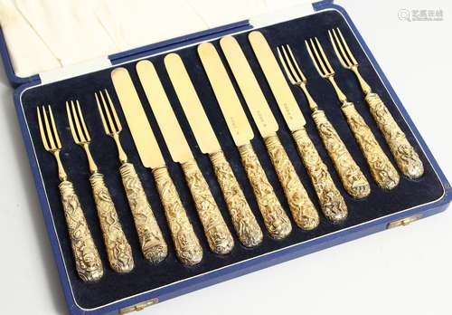 A GOOD SET OF SIX SLIVER GILT DESSERT KNIVES AND FORKS, the ...