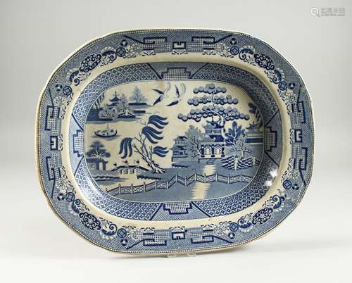 A WILLOW PATTERN BLUE AND WHITE DISH 16ins long.