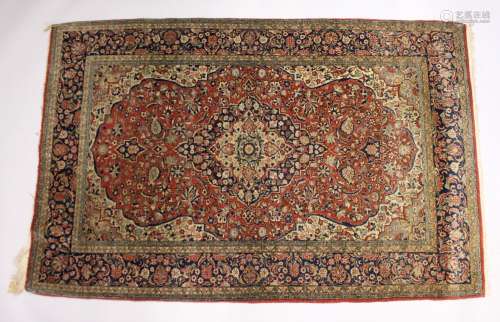 A GOOD PERSIAN RUG, early 20th Century red ground with styli...