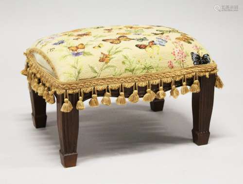 A SMALL FOOTSTOOL UPHOLSTERED with a butterfly tapestry mate...