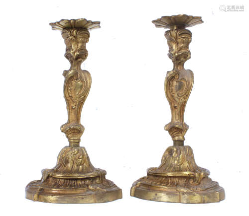 A pair of first half 20th century bronze candlesticks