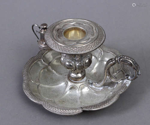 A silver candlestick circa 1800