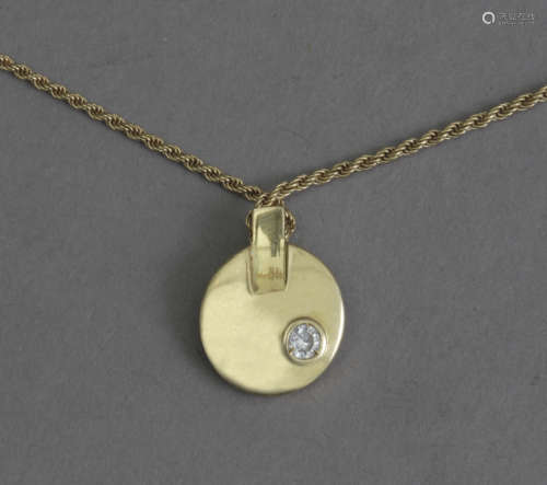 A diamond and gold pendant and chain