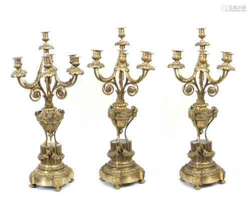 A set of three 19th-20th centuries bronze candlesticks
