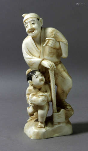 A 19th century Chinese ivory sculpture of a child and a lumb...