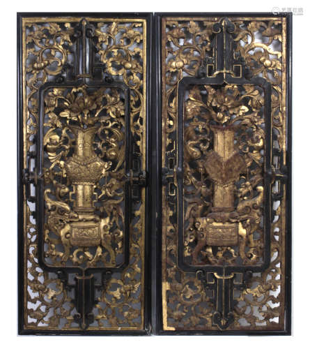 A pair of 20th century Chinese carved wall plaques