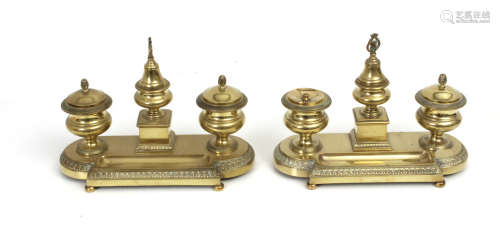 A pair of 20th century Empire style brass inkstands