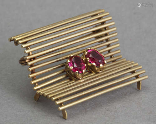 A mid 20th century gold and rubies brooch