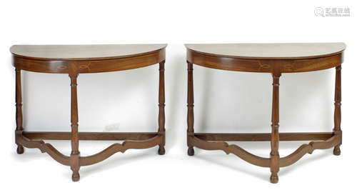 A pair of 20th century Empire style half moon walnut console...