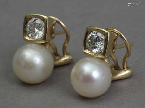 A pair of diamond and pearl 'toi et moi' earrings