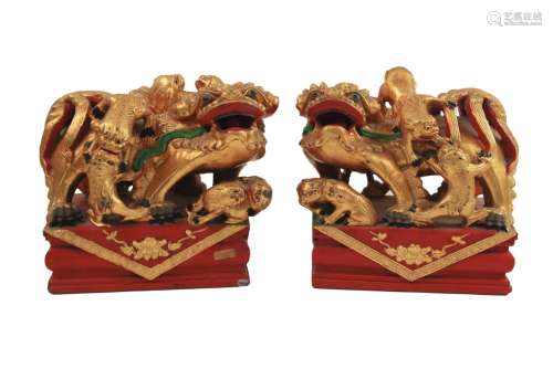 PAIR OF CARVED WOOD GILDED FOO LION