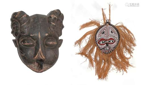 PAIR OF CARVED WOOD AND WOVEN  MASKS