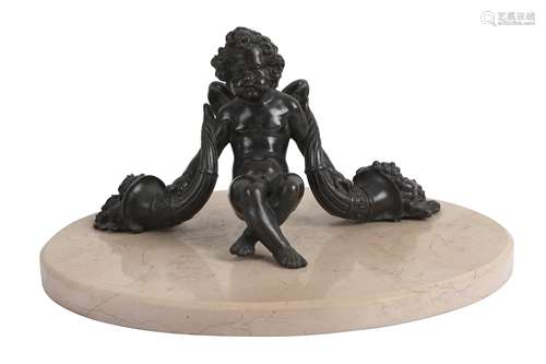 A BRONZE ARCHITECTURAL FRAGMENT OF A CHERUB, 19TH CENTURY