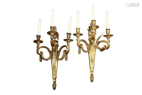 A PAIR OF FRENCH BRONZE THREE LIGHT WALL APPLIQUES, IN THE L...