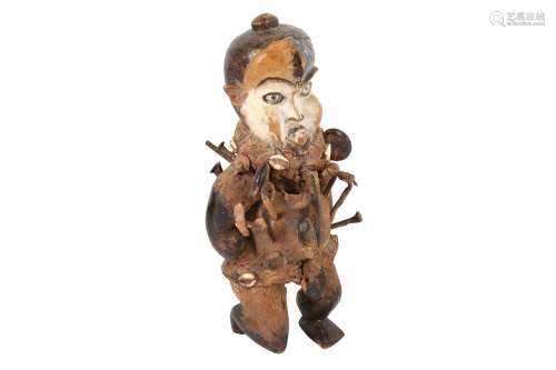 A TRIBAL HARDWOOD FETISH FIGURE OF A MAN, POSSIBLY CONGO, 20...