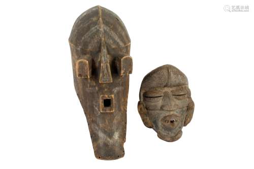 AN AFRICAN TRIBAL HARDWOOD MASK, IN THE MANNER OF SONGYE, 20...
