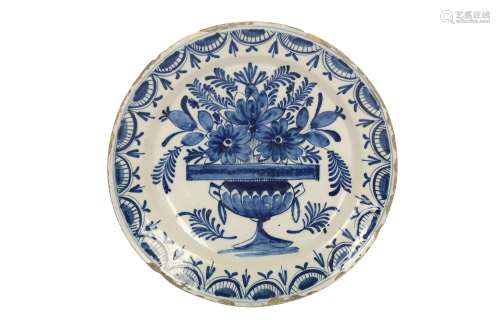 A CONTINENTAL BLUE AND WHITE TIN GLAZED EARTHENWARE POTTERY ...
