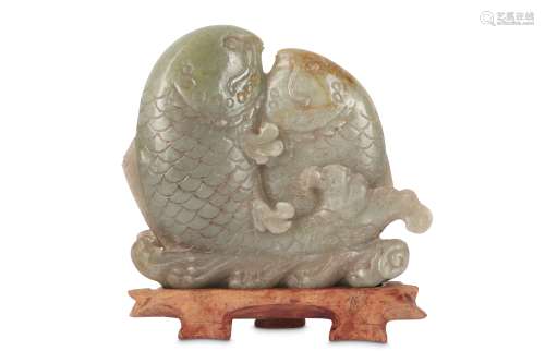A CHINESE PALE CELADON JADE 'DOUBLE FISH' CARVING.