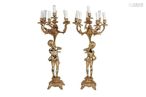 A PAIR OF GILT METAL SEVEN LIGHT CANDELABRA IN LOUIS XV STYL...