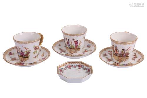 THREE CONTINENTAL PORCELAIN GILT AND PAINTED TEA CUPS, IN TH...