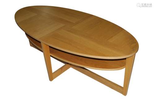 A CONTEMPORARY OVAL SOLID OAK AND OAK VENEERED ON CHIPBOARD ...