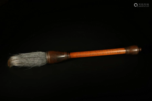 AN OLD BRUSH MADE OF BAMBOO