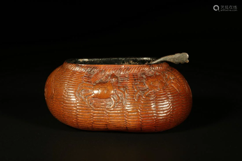 A MOULDED GOURD WATER CONTAINER