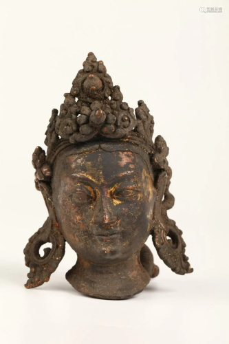 A GILT BRONZE BUDDHA HEAD STATUE