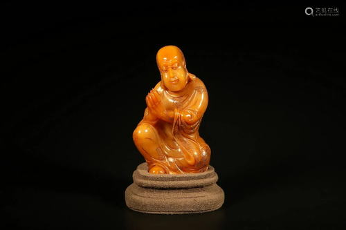 A TIANHUANG STONE LOHAN FIGURINE