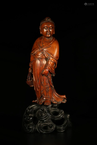 A GUANYIN STATUE MADE OF BOXWOOD