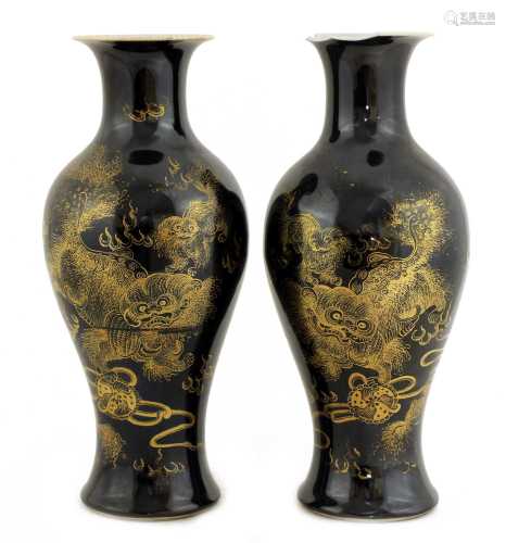 A pair of Chinese black-glazed vases,