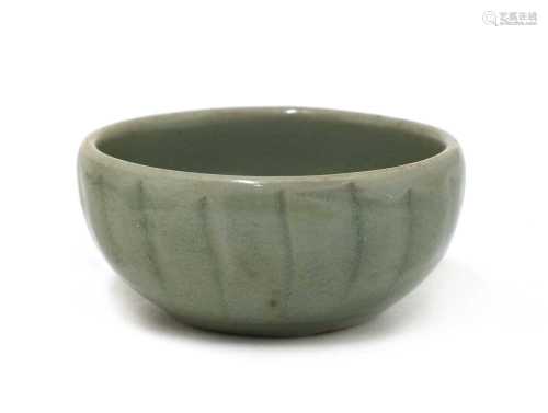 A Chinese celadon-glazed teacup,
