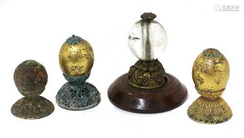 A collection of four Chinese hat finials,