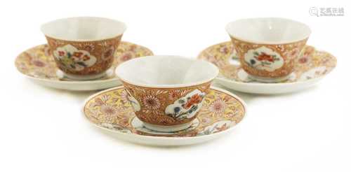 A collection of three Chinese famille rose tea cups and sauc...