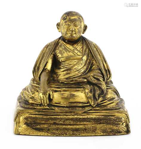 A Tibetan gilt-bronze figure,
