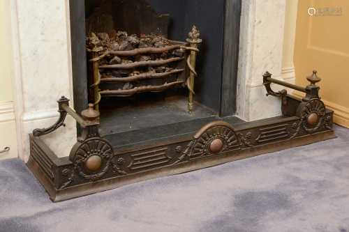 A Victorian cast iron and brass fire kerb,