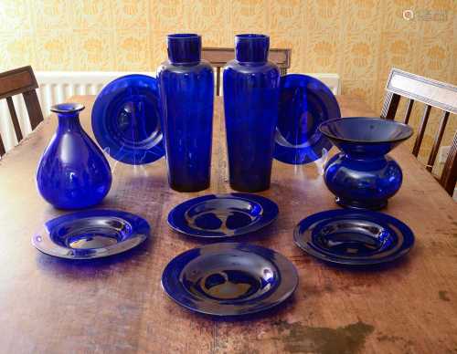 A collection of blue glass pieces,